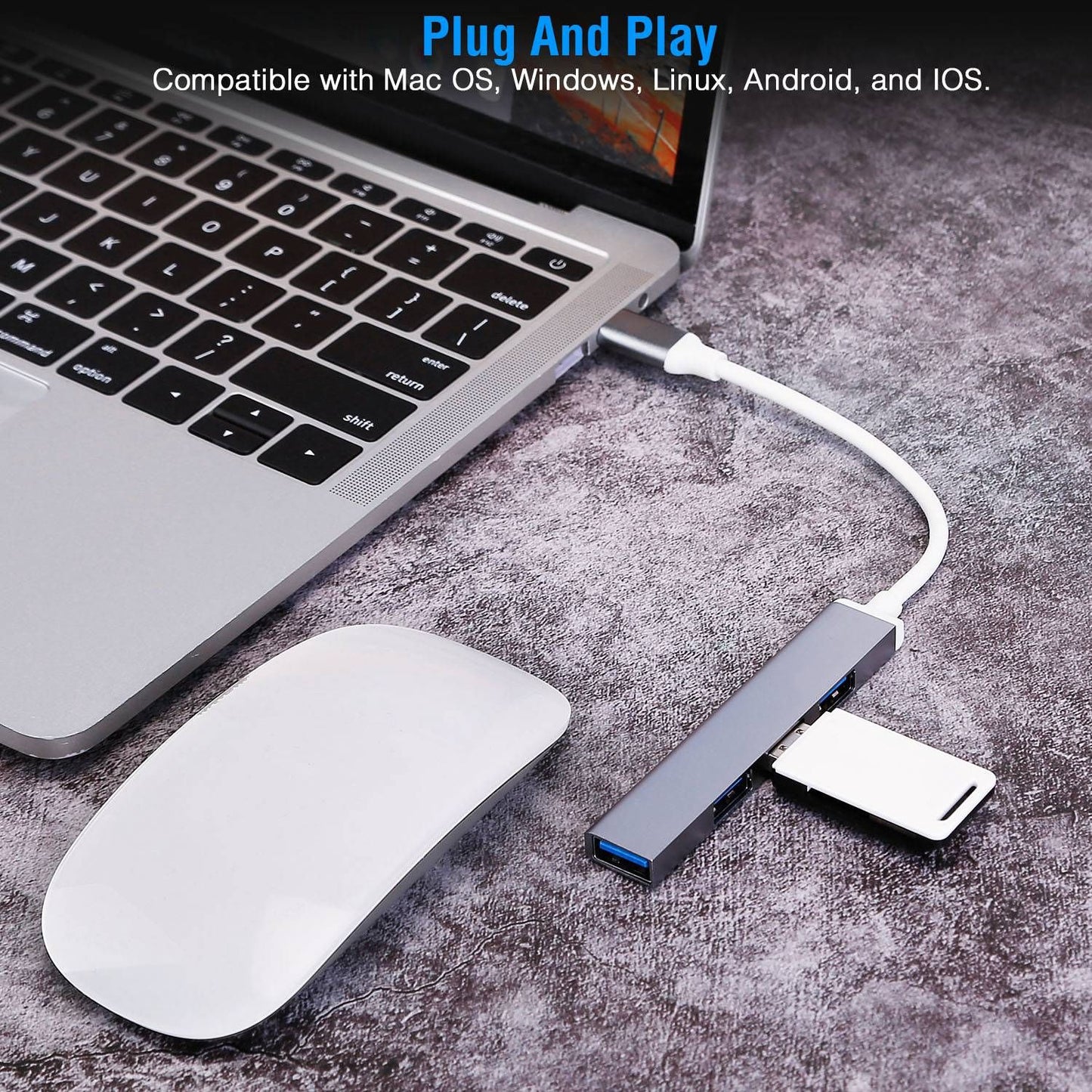 USB hub connected to a laptop, featuring multiple ports and a card reader, with a wireless mouse on a textured surface, highlighting its plug-and-play compatibility with various operating systems.