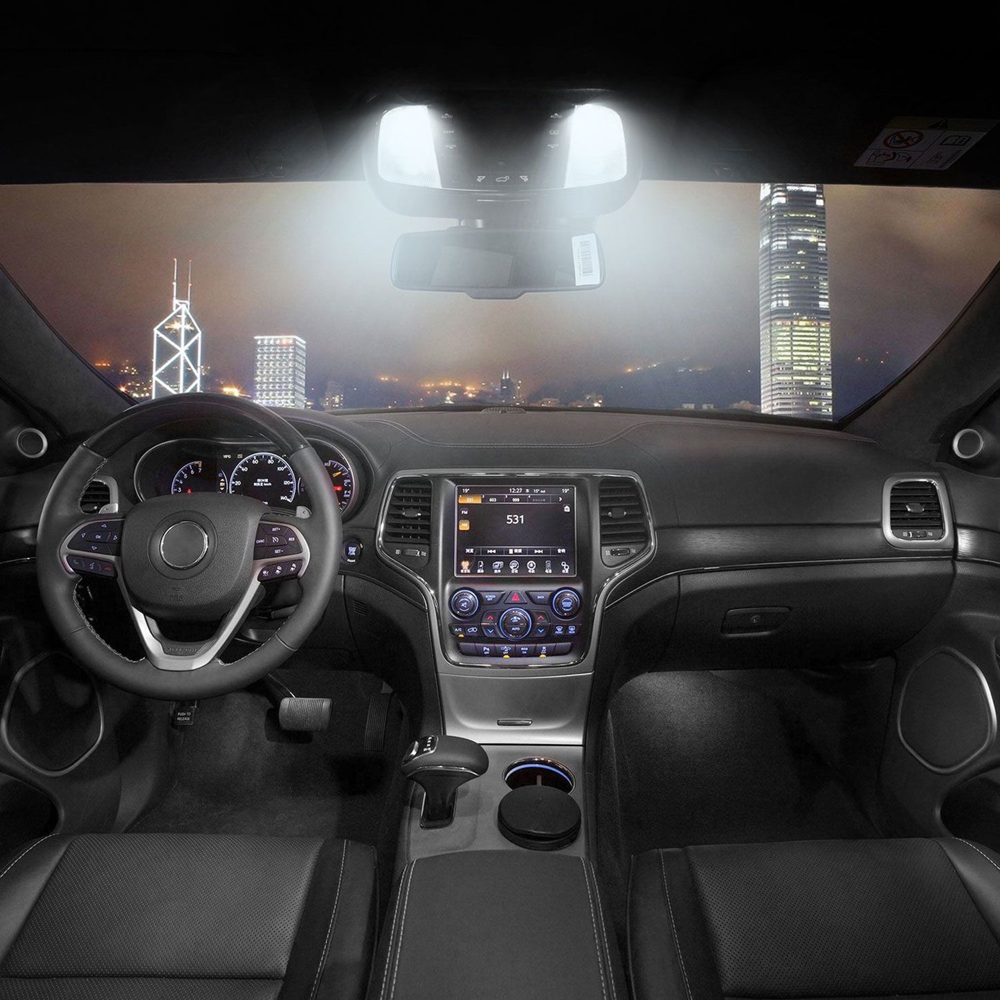 Luxurious car interior showcasing a modern dashboard with a touchscreen display, leather seats, and ambient lighting, set against a nighttime city skyline.
