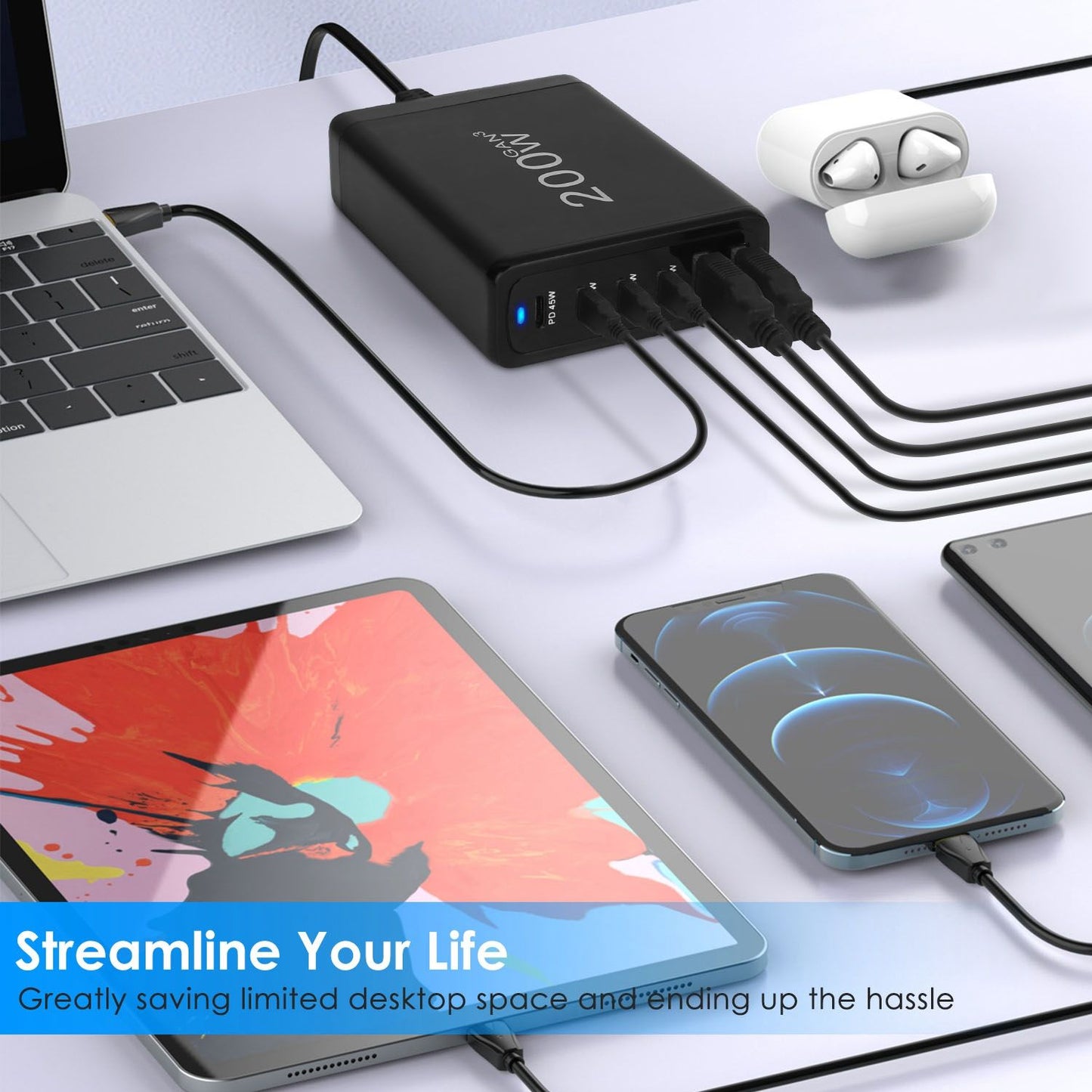 High-capacity 200W USB charging hub connected to a laptop, tablet, and two smartphones, showcasing streamlined charging solutions and organized desk setup.