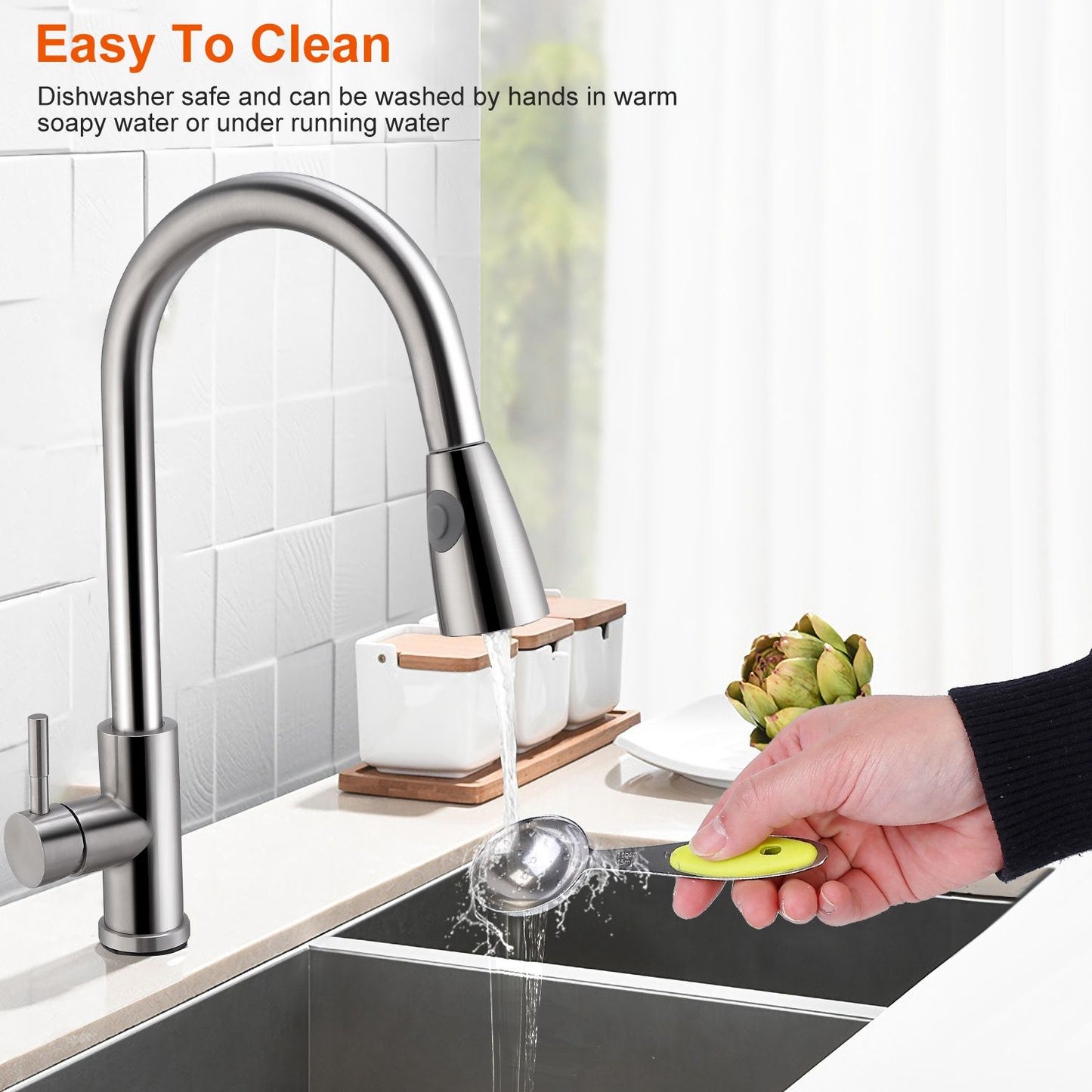 Stainless steel kitchen faucet with a modern design, showcasing easy cleaning and functionality as water flows from the spout while a hand holds a spoon, set against a bright, clean kitchen backdrop.