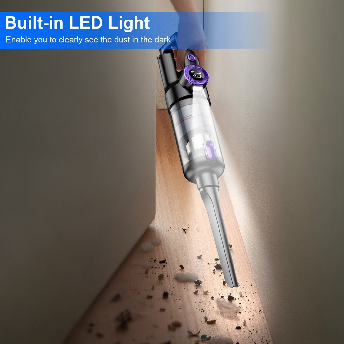 Handheld vacuum cleaner with built-in LED light, effectively illuminating dust and debris in hard-to-reach corners on wooden floor.