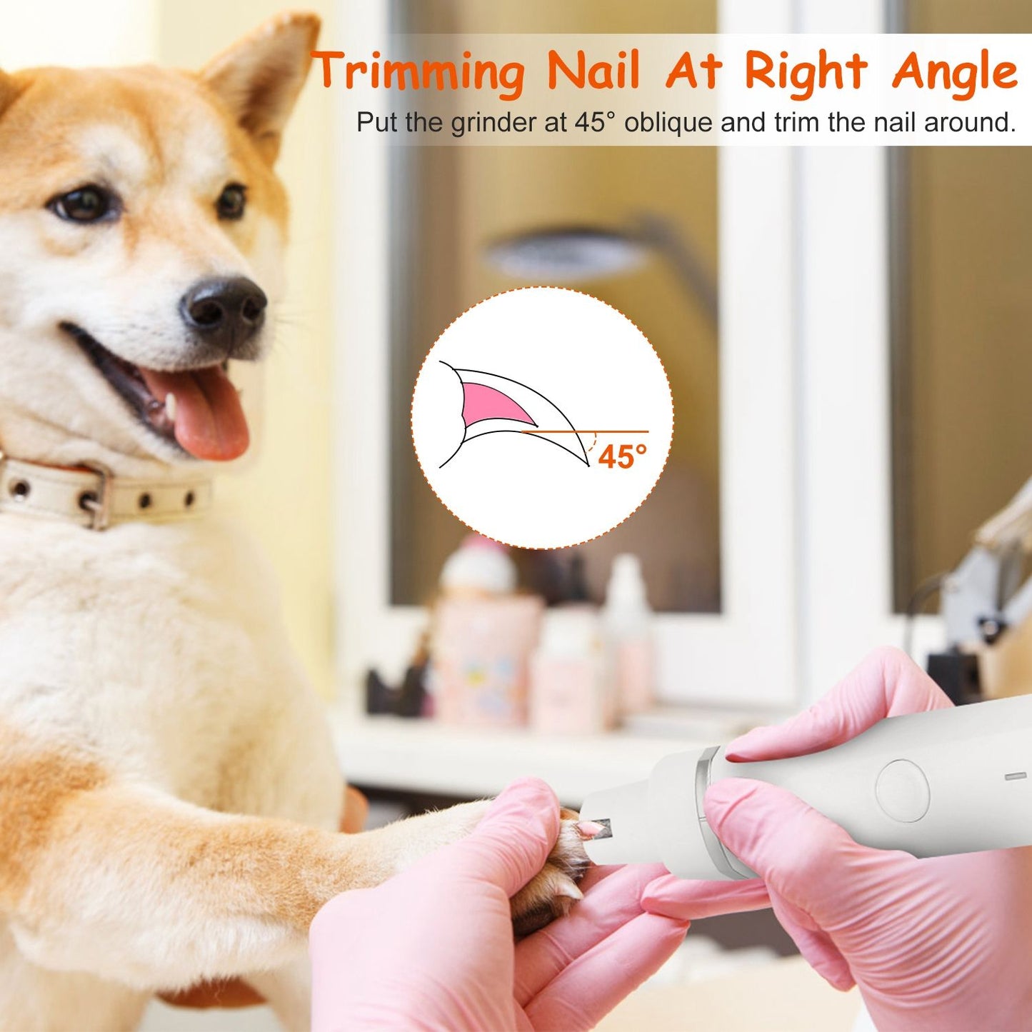 Dog nail grinder in use, demonstrating how to trim a dog's nail at a 45-degree angle, with a soft pink background, hands in pink gloves, and pet care products visible in the background.