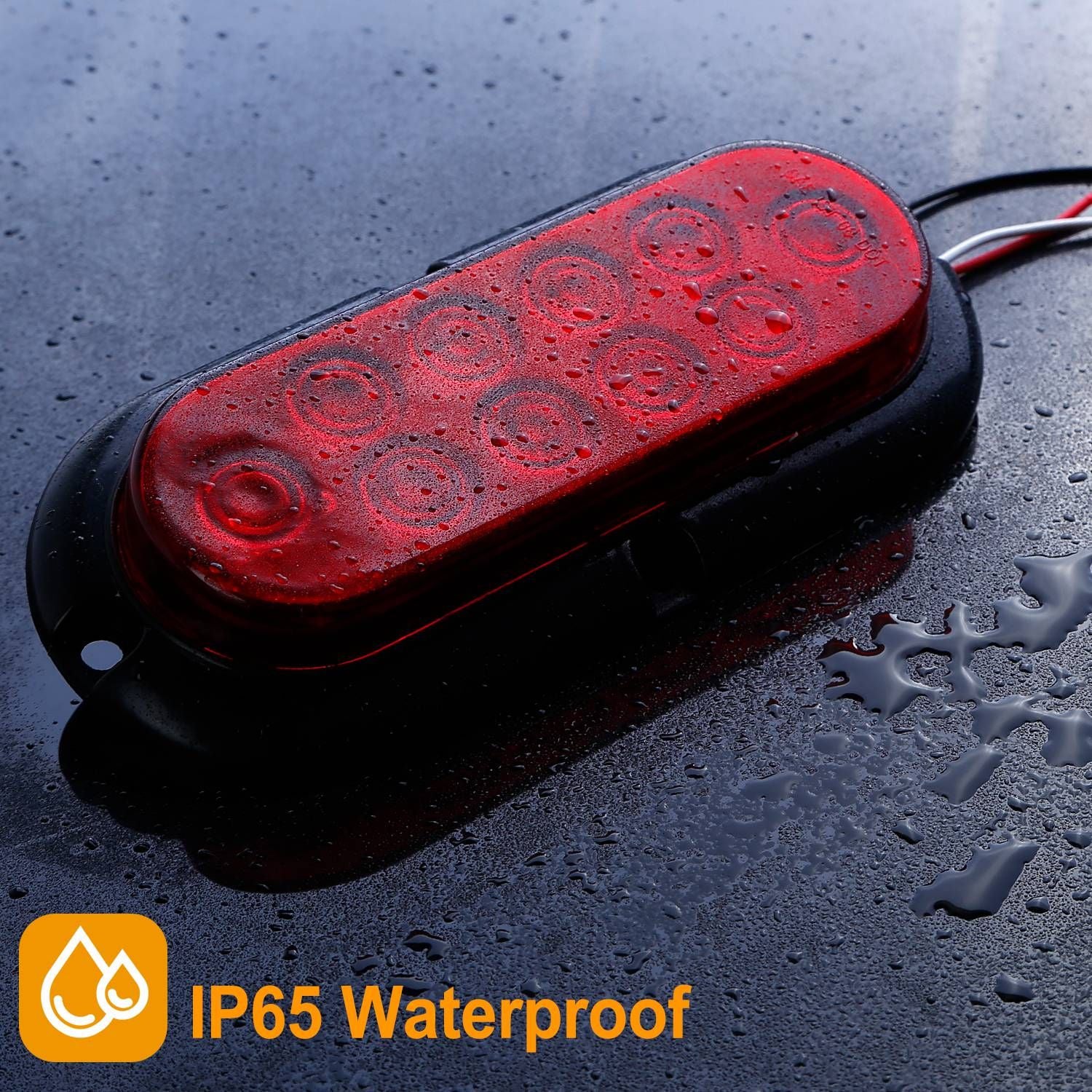 Red LED trailer light with IP65 waterproof rating, showcasing water droplets on a reflective surface.