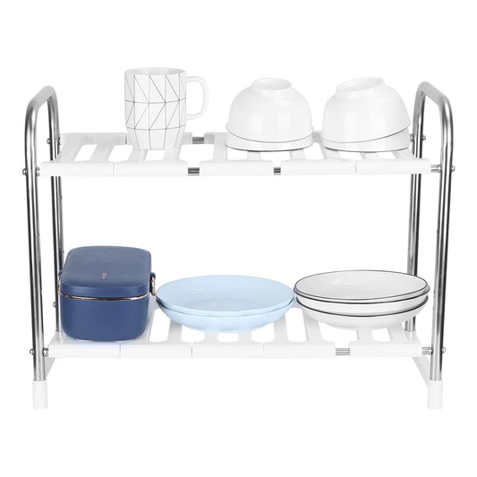 Two-tier kitchen shelf organizer displaying elegant white bowls, a patterned mug, a blue lunchbox, and assorted plates, ideal for maximizing storage in small spaces.