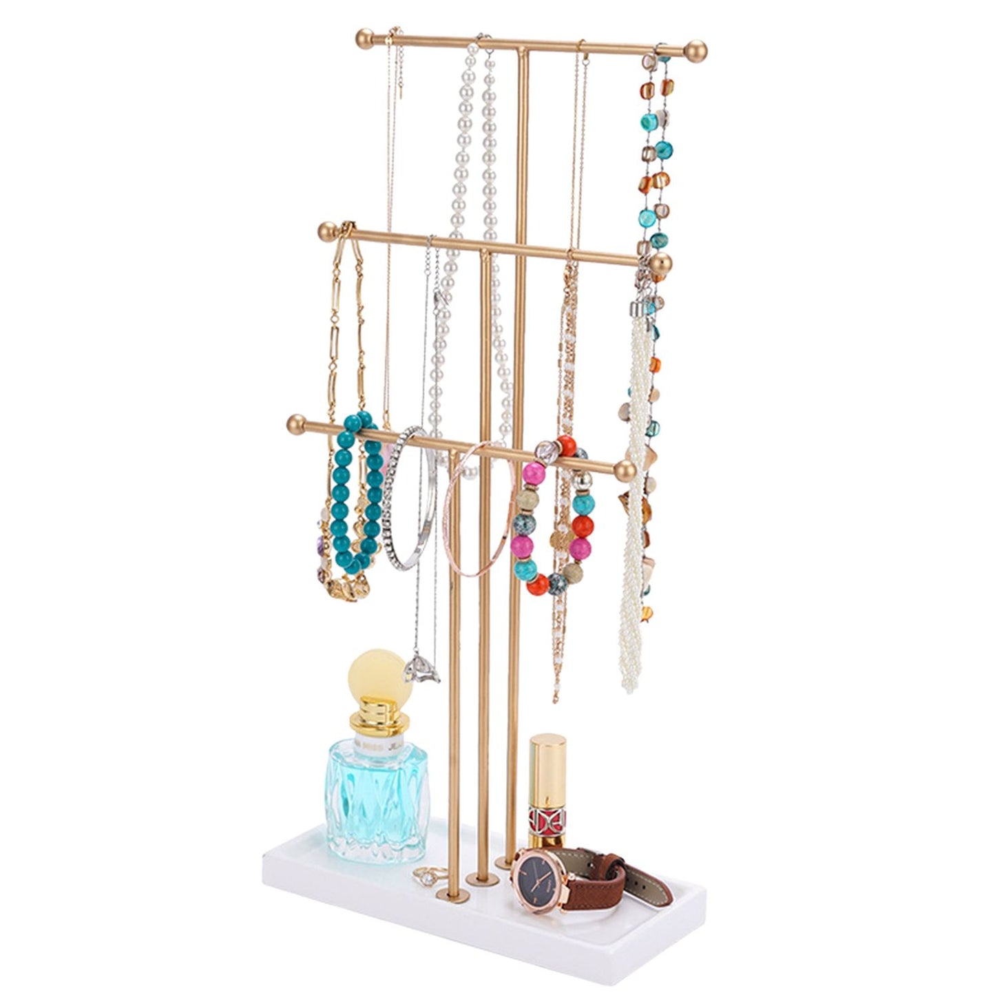 Gold jewelry organizer stand displaying colorful necklaces, bracelets, and a watch, with a decorative perfume bottle and lipstick on a white base.