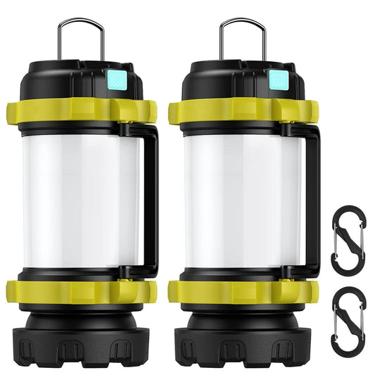 Two durable outdoor lanterns in black and yellow with transparent bodies, featuring handles for easy carrying and two included carabiners for hanging or securing.