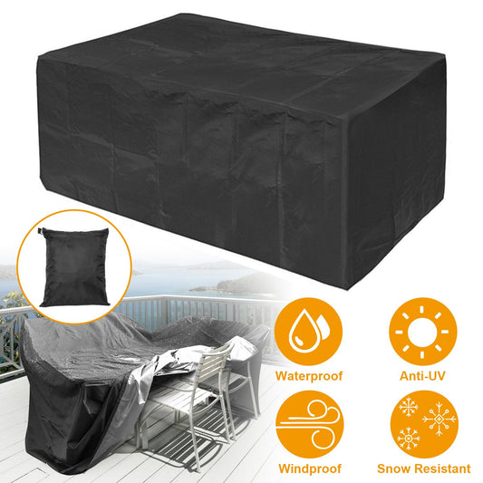 Durable black outdoor furniture cover, waterproof, windproof, and snow resistant, displayed on a deck with a storage bag included.