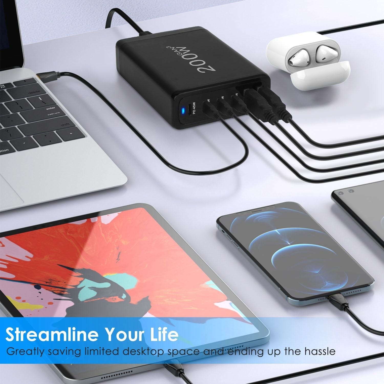 High-capacity 200W USB charging hub connected to a laptop, tablet, and two smartphones, showcasing streamlined charging solutions and organized desk setup.