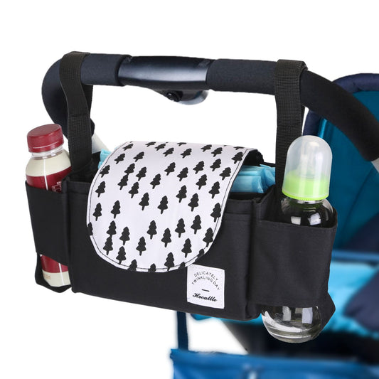 Black stroller organizer with tree-patterned flap, featuring compartments for bottles and baby wipes.