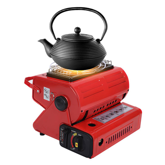 Portable red gas stove with a black cast iron kettle on top, designed for outdoor cooking and camping.
