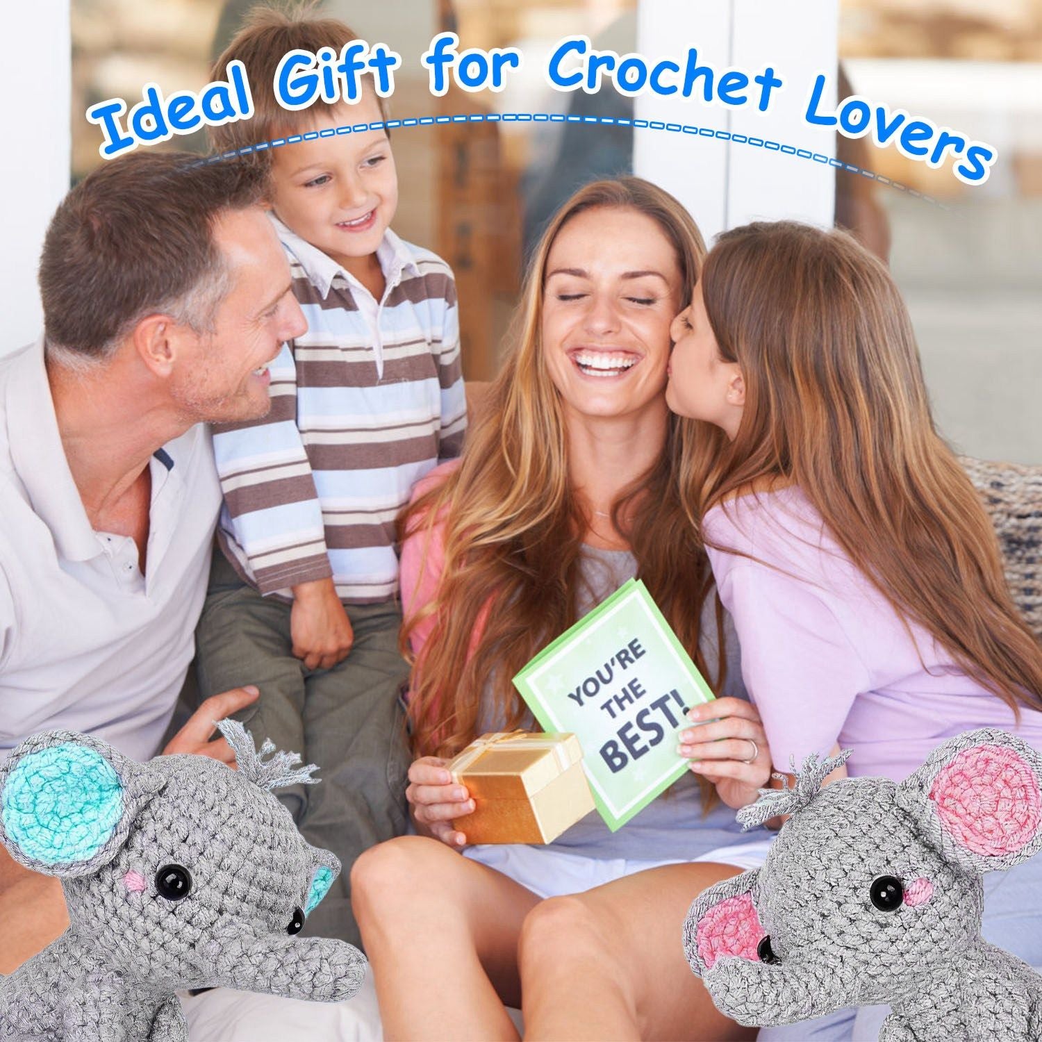 Family celebrating with a woman holding a "You're the Best!" card and a gift box, featuring cute crocheted elephant toys on either side, perfect for crochet lovers.