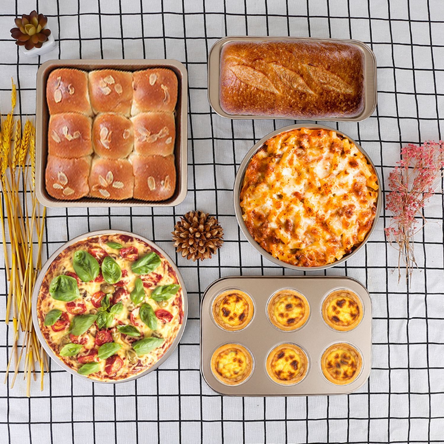 An assortment of delicious baked goods and dishes displayed on a checkered tablecloth, featuring fresh lasagna, a pepperoni and spinach pizza, sweet bread rolls, egg tarts, and a loaf of bread, garnished with decorative elements.